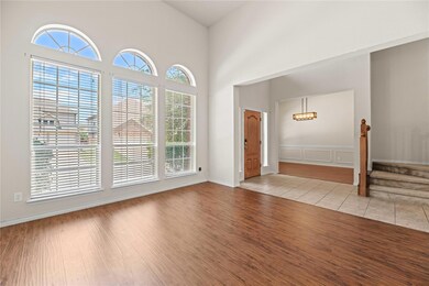 Entryway featuring a high ceiling and hardwood / w
