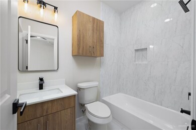 Full bath featuring vanity and bathtub / shower combination