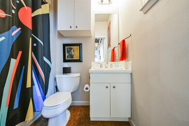 The first floor bathroom offers a tub-shower combo
