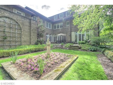 Peaceful backyard with stone patio and gracious ga