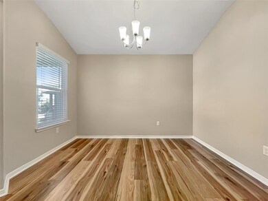 Unfurnished room featuring a chandelier and light