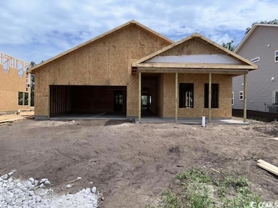 View of front of house featuring a garage and cooling unit