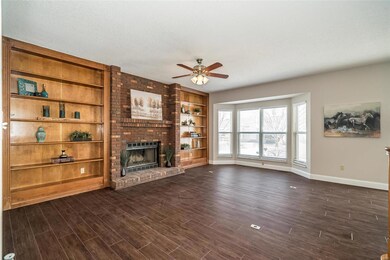 Light bright Great room with built in bookshelves,
