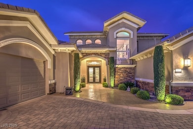 Exterior entry at twilight with stone siding, deco