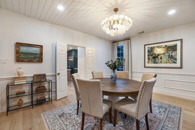 The formal dining room is complete with doors that lead to the impressive kitchen.