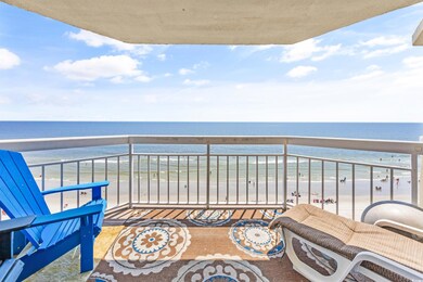 Balcony with a beach view and a water view