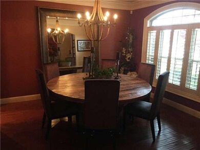 Dining Room. Formal dining, plantation shutters with nice view of professionally landscaped beds.