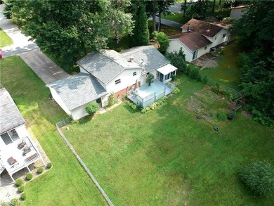 Aerial view shows the back yard with almost half a