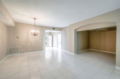 View of the dining room, entry way and den.