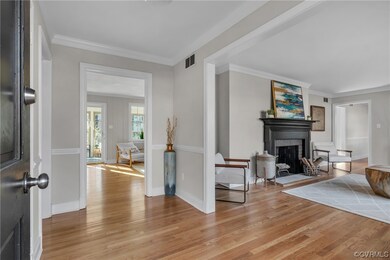 Living room featuring ornamental molding and light
