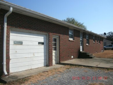 Back View. Garage used for storage room.