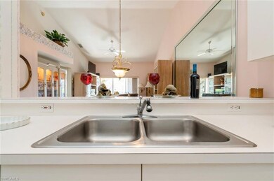 Room details with white cabinets, decorative light