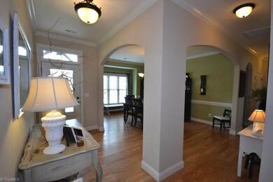 Entry - Arched Doorways, Hardwood Floors