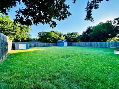 View of yard featuring a storage shed