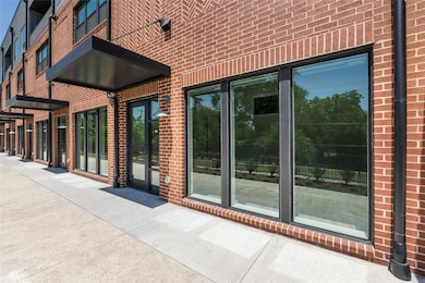 Doorway to property with brick siding