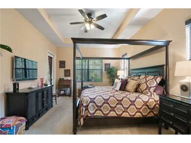 Master bedroom overlooks preserve and has access to lanai