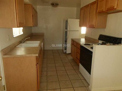 Kitchen. Galley kitchen, 12x12 tile. Formica count