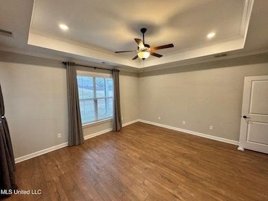 Empty room with wood finished floors, baseboards, 