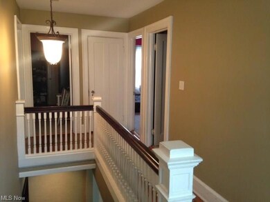 2nd floor hallway and stairwell, showing entry to 2 of the 3 bedrooms on this floor and the door to the 3rd floor master bedroom and bathroom.