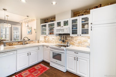 Bright, beautiful cabinetry to showcase your kitchen wares. Notice the large pantry on the right.