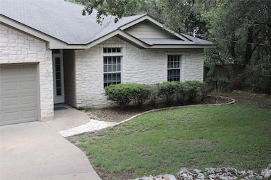 View of front of property featuring stone siding,