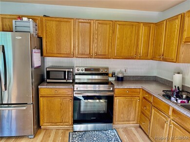 Kitchen featuring stainless steel appliances Frigi
