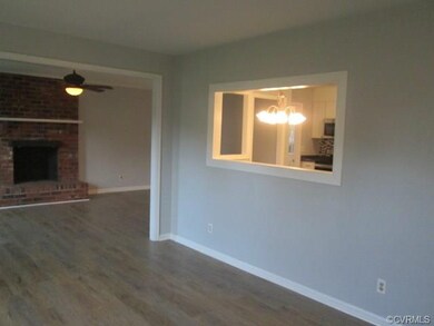 Living room which leads into the family room.  Not