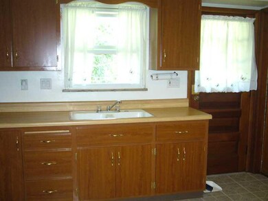 Kitchen. Large eat-in kitchen with a door to the b