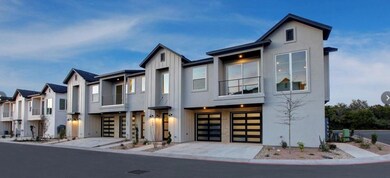 Modern home with driveway, an attached garage, bo