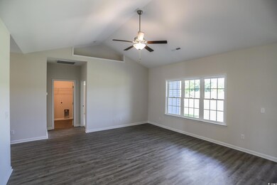 Empty room with lofted ceiling, dark hardwood / wo