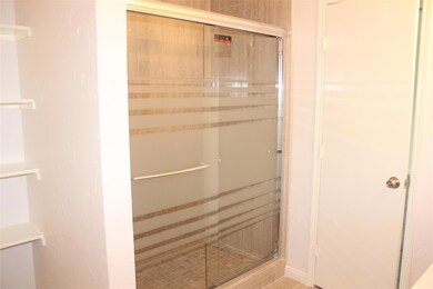 Bathroom featuring walk in shower