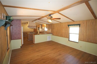 Living Room with vaulted ceiling & new vinyl plank