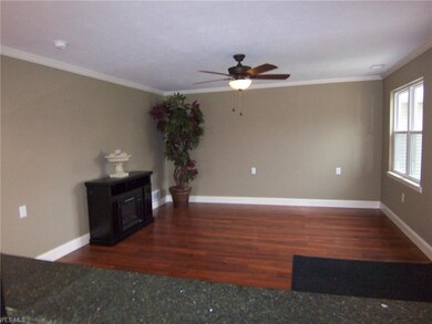 View of the living area showing the electric firep