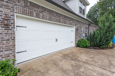 Garage with concrete driveway