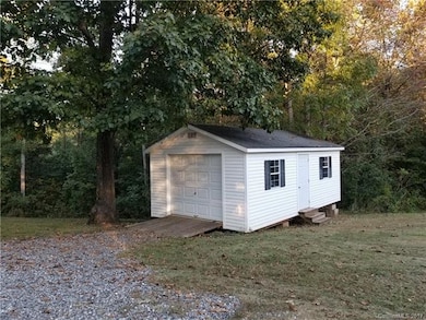 Garage door is ideal for lawn mowers or four wheel