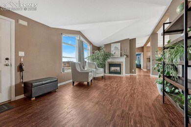 Living area featuring visible vents, baseboards, a
