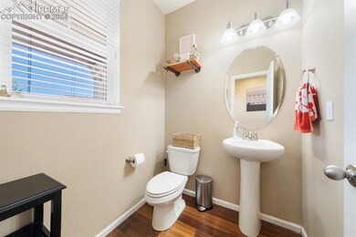 Bathroom featuring hardwood / wood-style floors, t