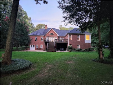 Back of property featuring a chimney, a patio area