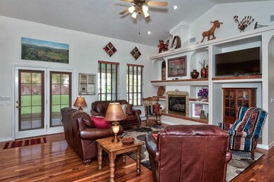 Vaulted ceilings soar above this home's open and i