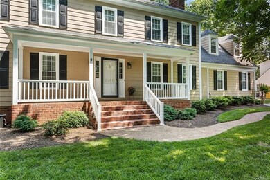 Slightly winding, aggregate walkway leads to brick