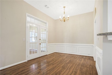 Spacious dining area off of kitchen; door leads to