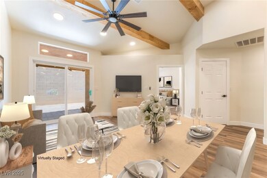 Dining space with wood finished floors, recessed l