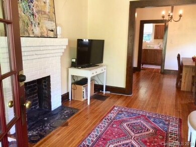 Living Room w/Decorative Fireplace, Hardwoods, and