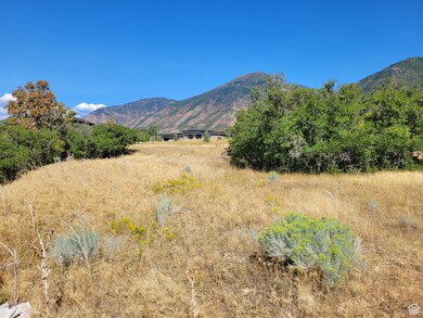 View of mountain backdrop with rural landscape