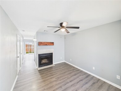 Unfurnished living room with ceiling fan, wood fin
