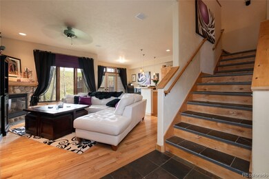Living area with stairs heading up to Master Bedroom