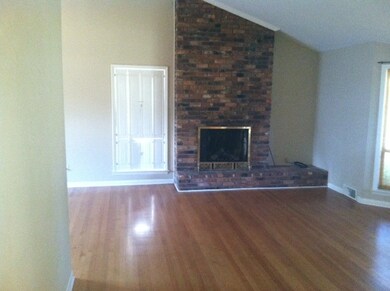 hardwood floors, vaulted ceiling and  fireplace