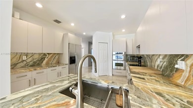 New Cabinets, large kitchen Open Space. Onyx Slab counters & backsplash