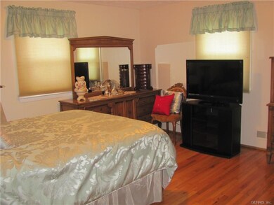 Master bedroom features hardwood floors