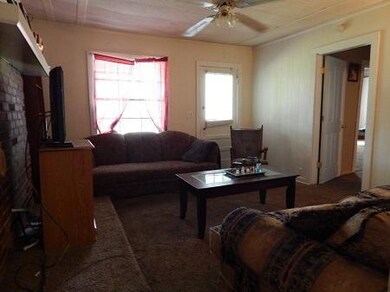 Living room is conveniently located off of kitchen.  